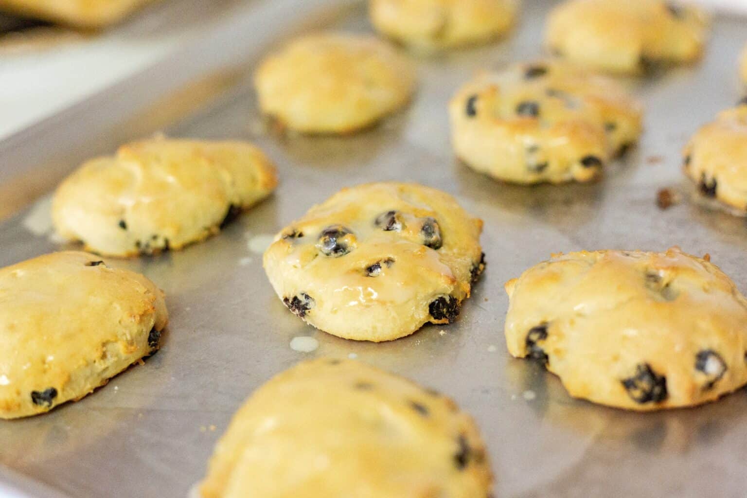 A display of blueberry biscuits with lemon glaze.